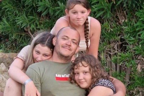 A photo of James Cook with his three children.