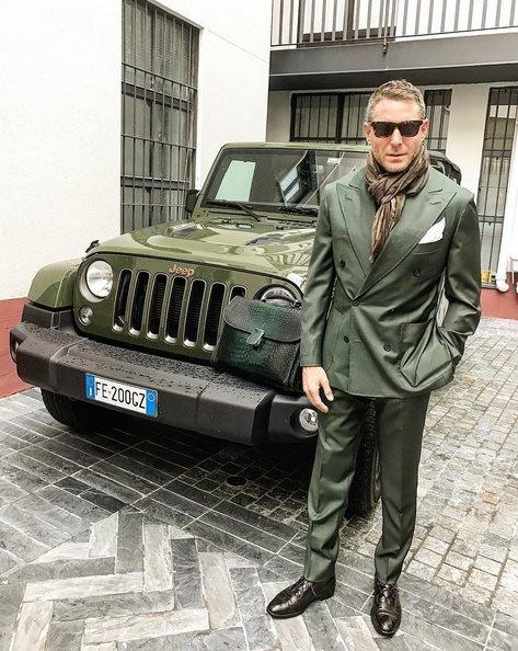 Lapo Elkann poses with a green car