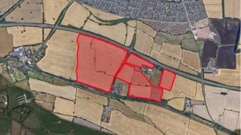 A red area on a map showing where the solar farm would be.