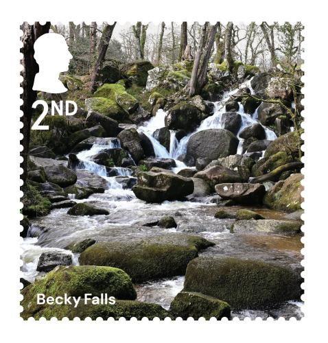 A photograph of Becky Falls on a second class stamp.