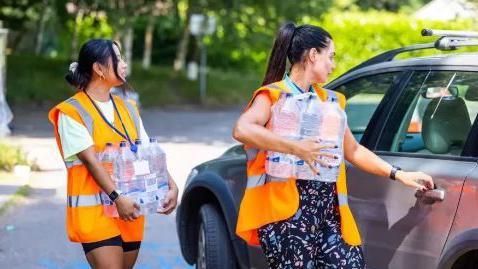 South East Water employees delivering bottled water last June