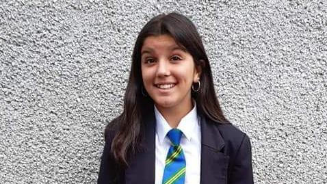 Katy - young girl smiling, wearing a school uniform