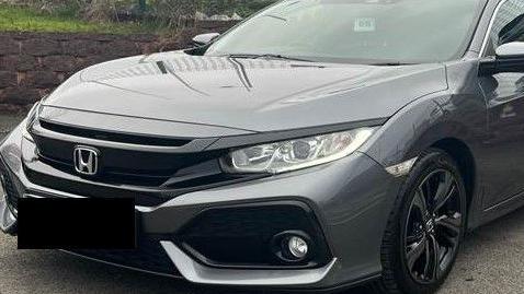 The front end of a dark grey Honda Civic car