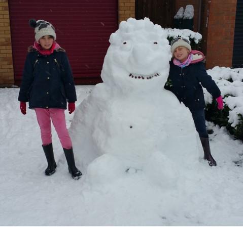 Girls and a snow gorilla