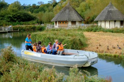 A boat carries visitors around the Arundel Wetland Centre