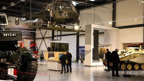 visitors-looking-at-historic-army-vehicles.