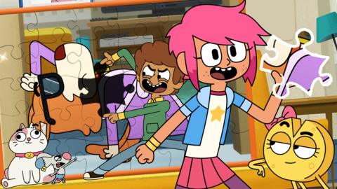 Girl is at the front smiling holding a jigsaw piece, cheese is below her looking up at the piece. Behind them is boy, cat and mouse they are sat against a giant jigsaw of dog