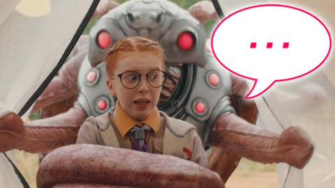 Tilda is looking shocked next to an alien