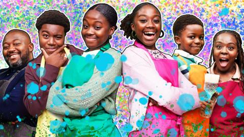 Kwapong family pose surrounded by paint splatters.