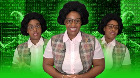 A black woman in a cardigan and glasses is in front of green computer code and robots