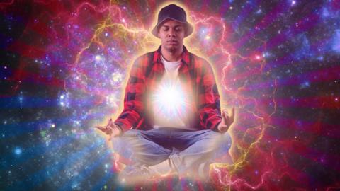 A young man in a bucket hat is levitating in space