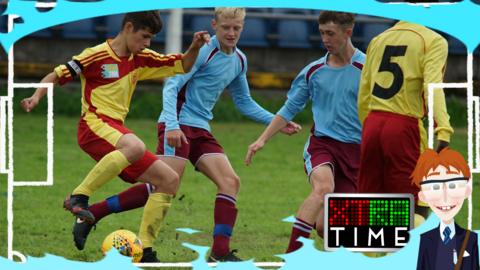 Jamie Johnson tackling another footballer for the ball.