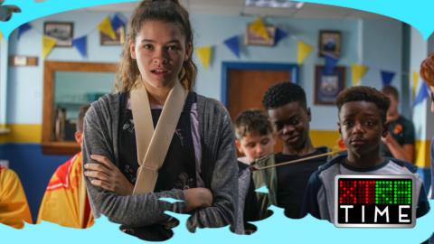 A girl with her arm in a sling looking shocked. Ruby from CBBC series Jamie Johnson.