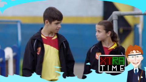 A boy and a girl walk along side each other