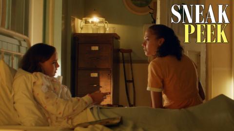 Celeste holds a lit lantern.