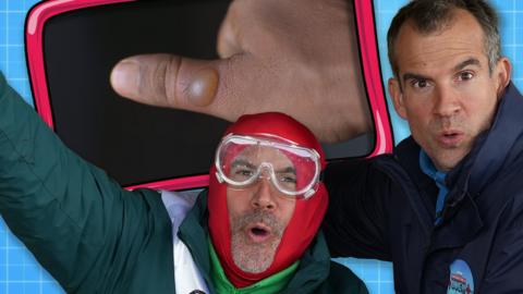 Chris and Xand smile in front of someone with a blister