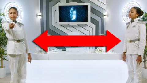 Two identical young girls are stood apart with a large, red, double ended arrow between them