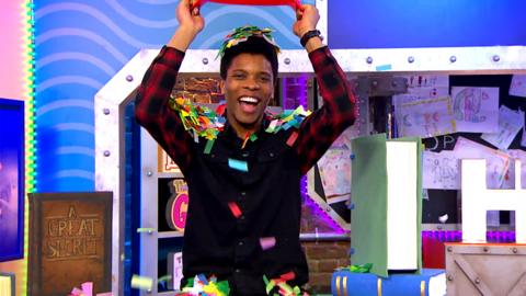 CBBC Book Club 2021 With Rhys on the CBBC HQ set and a bucket with confetti being poured over him