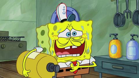 SpongeBob is looking uncomfortable while holding a massive bottle of mustard