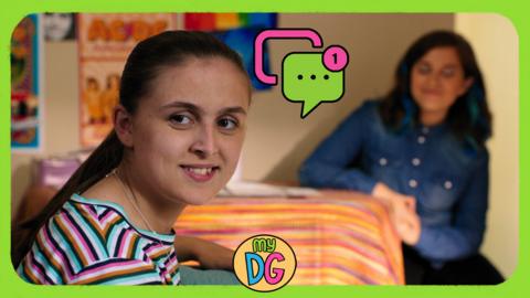 A girl, Jody from The Dumping Ground is looking round and smiling.