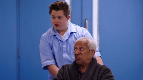 Finn taking Larry around the hospital.
