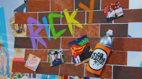 A graffiti wall with 'Ricky' written on it.