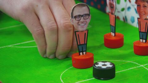 A table-top flick football game.