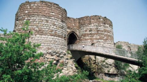 An old castle keep and bridge