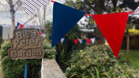 Image of celebratory bunting laid across the Blue Peter garden.
