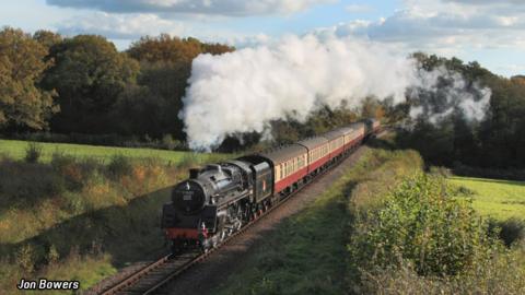 A train driving through the country