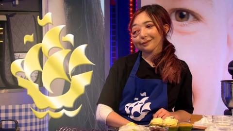 Nikki Lilly next to a gold Blue Peter badge.