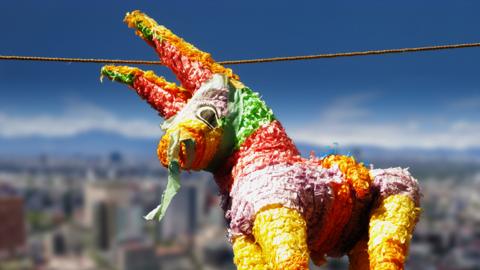 Donkey pi\u00F1ata above Mexico City.