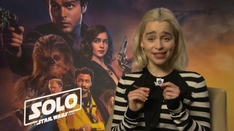 Emilia Clarke with a Blue Peter badge