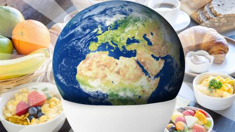 The world in a bowl, in front of a breakfast spread.