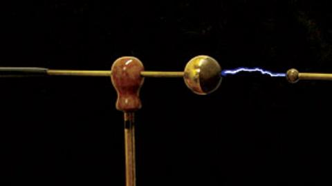 A machine is showing a bolt of electricity conducting.