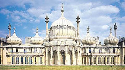 The exterior of The Royal Pavilion, a large, white ornate building that resembles the Taj Mahal.