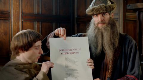 Johannes Gutenberg stands with a contract next to a shocked looking monk.