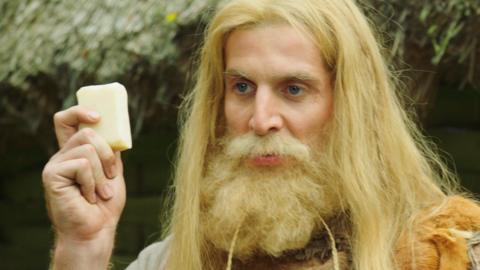 A viking holding soap.