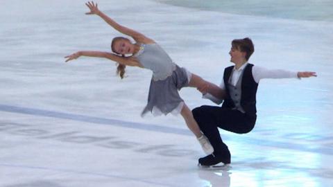 Skaters Josh and Lucy from Ice Stars dance together on the ice.