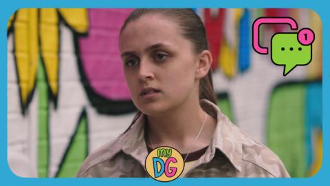 A girl against a colourful wall looking upset. Jody from The Dumping Ground.