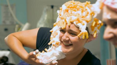 Tilly with shaving foam and cheetoes on her head.