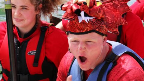 Jack Ramsay shouting on a Dragon Boat.