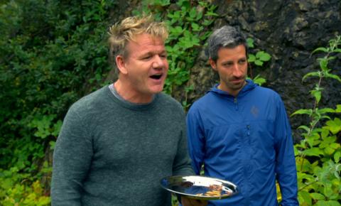 Gordon holding a plate with bugs on.