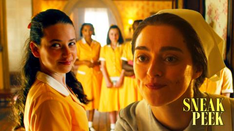 A group of school girls in yellow uniforms smirk, the matron is added to the picture and she doesn't look impressed.