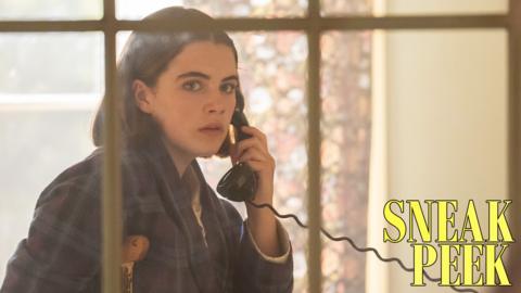 Darrel from Malory Towers, a young girl with short brown hair, she looks worried as she holds a phone.