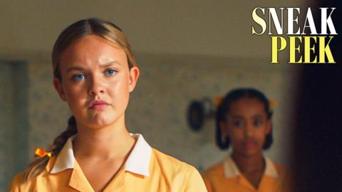 Gwen from Malory Towers, she looks worriedly at a figure in the foreground.