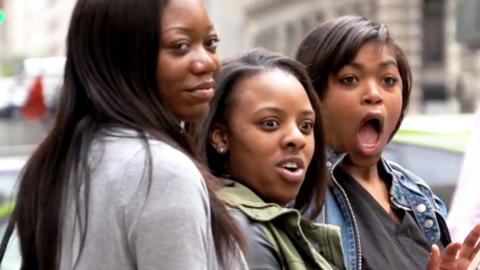 Three ladies looking shocked.