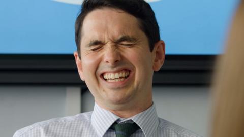 Mr Malone laughing.