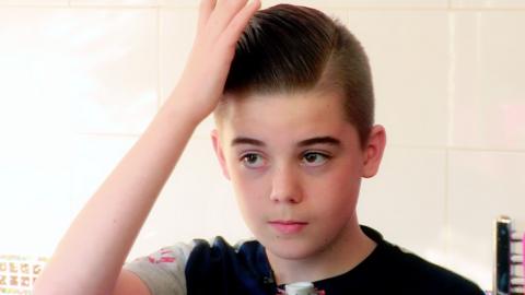 Archie styling his hair