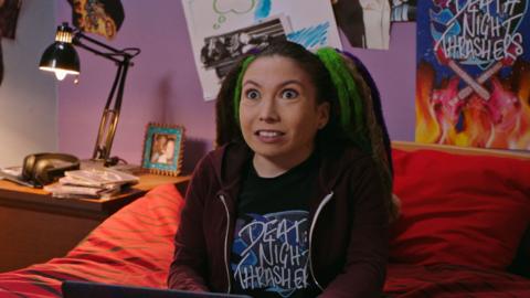Sasha sat on her bed in her Death Night Thrasher tshirt.